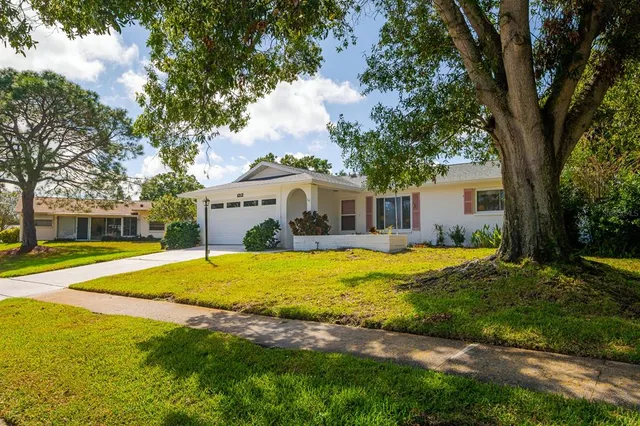 a front view of a house with swimming pool and porch