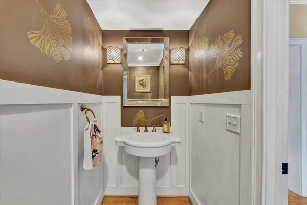 a kitchen with a stove sink cabinets and microwave