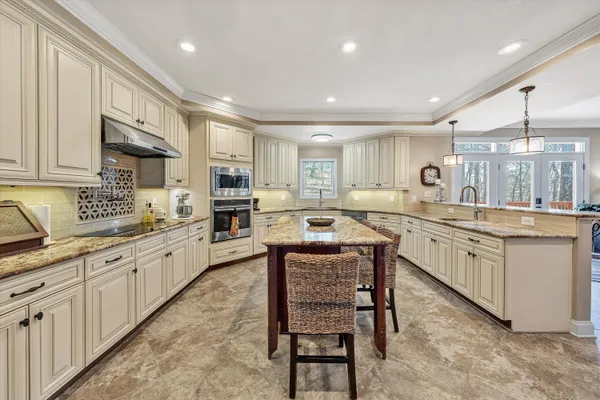 a kitchen with counter top space cabinets and appliances