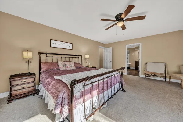 a living room with furniture a fireplace and a table