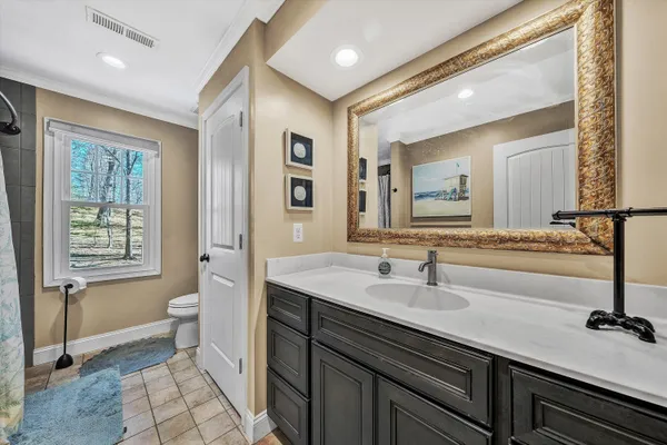 an empty room with furniture and windows