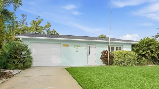 an aerial view of residential houses with outdoor space and lake view