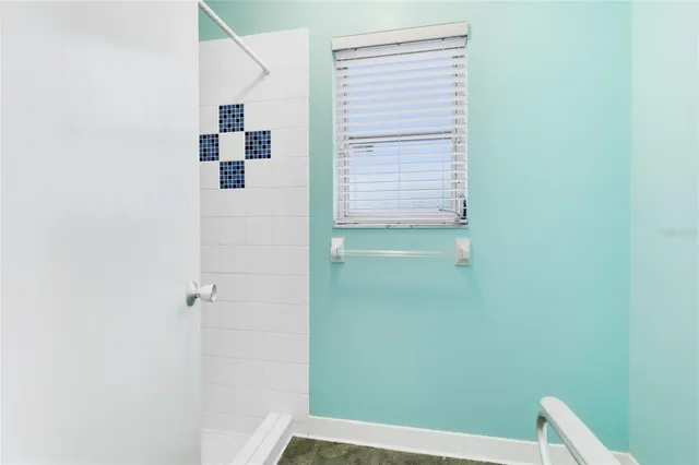 a backyard of a house with a garden and plants