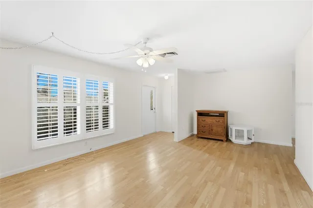 a kitchen with white cabinets appliances and a sink