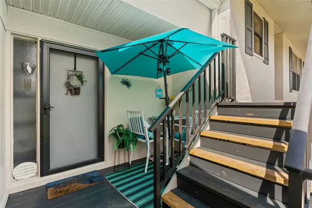 a view of entryway with wooden floor