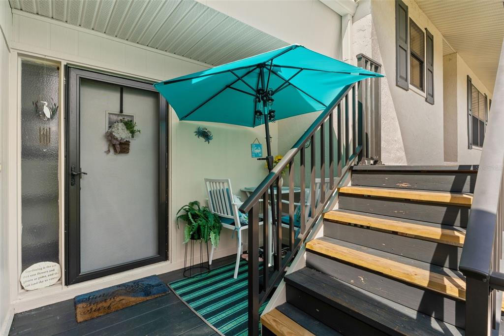 a view of entryway with wooden floor