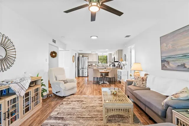 a living room with furniture and a rug
