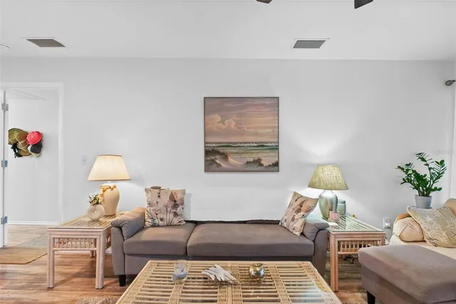 a bedroom with furniture and a lamp