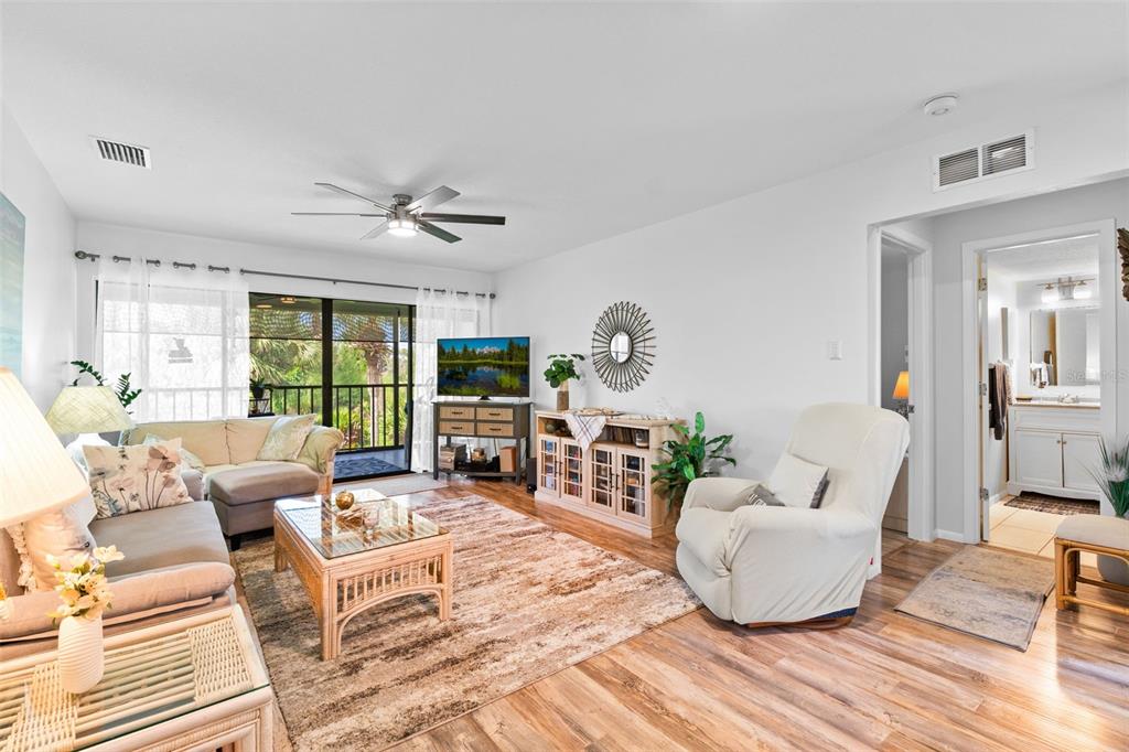 4260 Placida Road, Unit 17A Englewood, FL 34224 - Photo 15 of 34 a living room with furniture and a large window