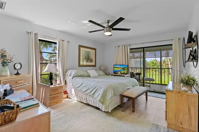 a bedroom with a balcony a bed and a couch