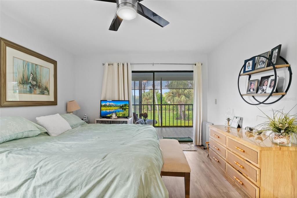 4260 Placida Road, Unit 17A Englewood, FL 34224 - Photo 18 of 34 a bedroom with a bed mirror and window