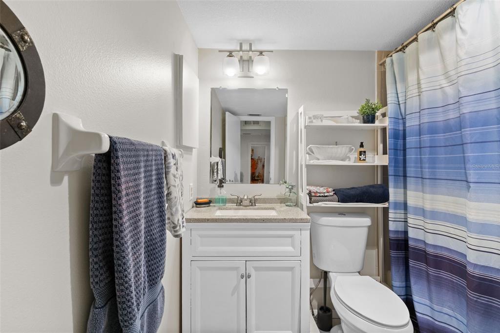 4260 Placida Road, Unit 17A Englewood, FL 34224 - Photo 22 of 34 a bathroom with a sink toilet vanity and tub