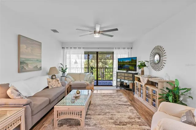 a living room with furniture fireplace and a flat screen tv