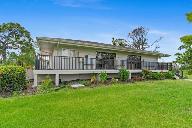 a view of a house with a yard porch and sitting area