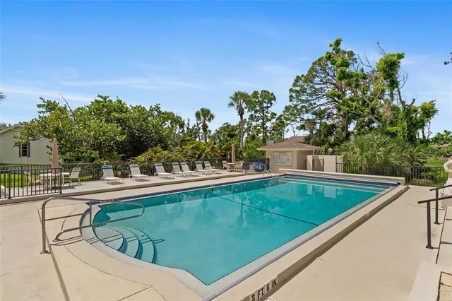 a view of a swimming pool with a patio