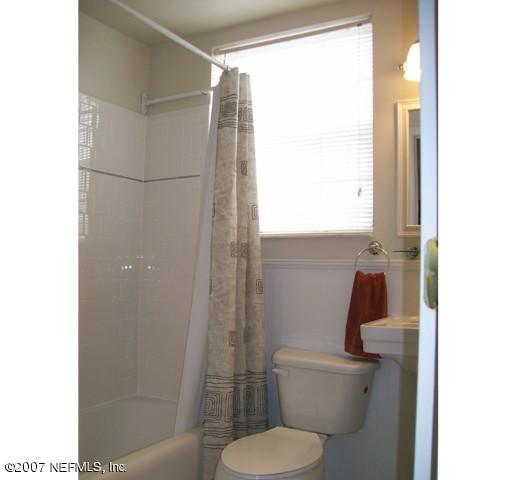 4012 Dover Road Jacksonville, FL 32207 - Photo 16 of 20 a white toilet sitting next to a shower