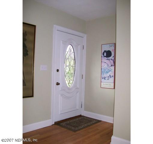 4012 Dover Road Jacksonville, FL 32207 - Photo 3 of 20 a view of a hallway with wooden floor