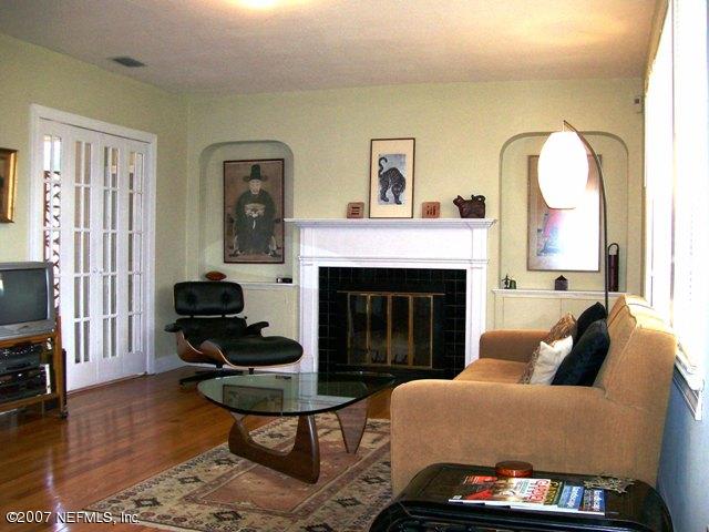 4012 Dover Road Jacksonville, FL 32207 - Photo 5 of 20 a living room with furniture a fireplace and a flat screen tv