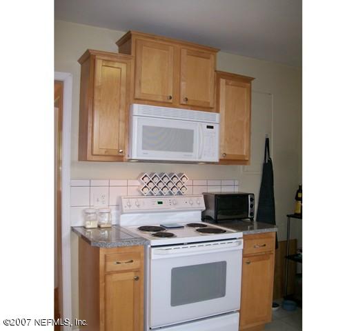 4012 Dover Road Jacksonville, FL 32207 - Photo 8 of 20 a kitchen with a stove and a microwave