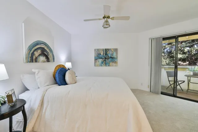 a bedroom with a bed and a table