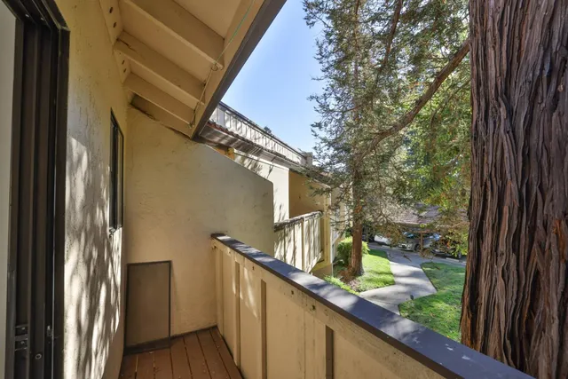 a view of balcony with wooden floor