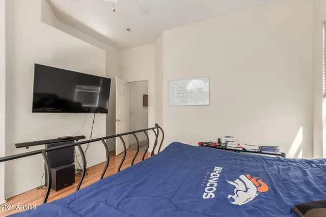 a bedroom with a bed and window