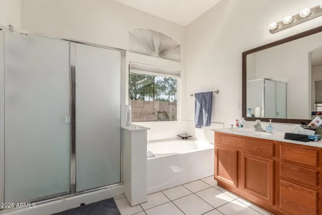 a bedroom with a bed and a table in it