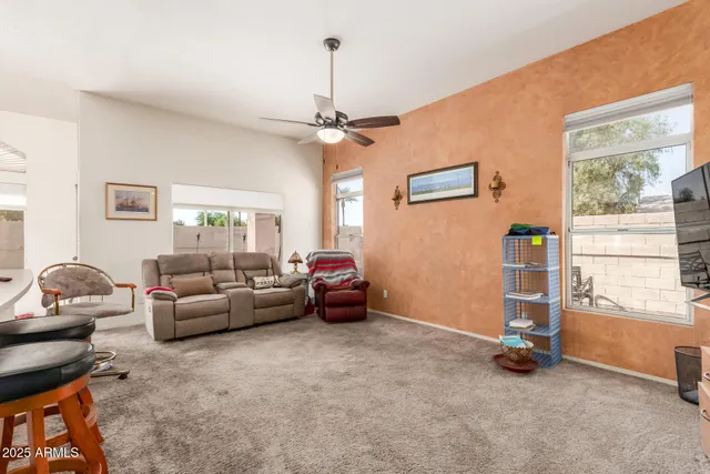 a living room with furniture and a window