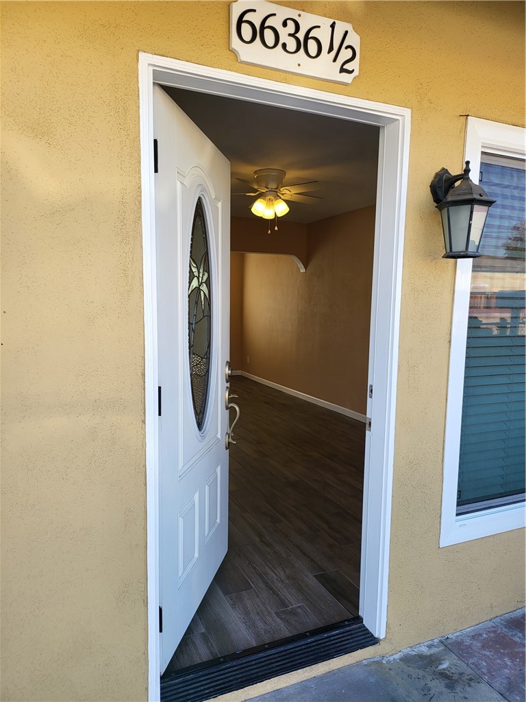 6636 Granger Avenue Bell Gardens, CA 90201 - Photo 3 of 11 a view of a hallway with wooden floor and entryway
