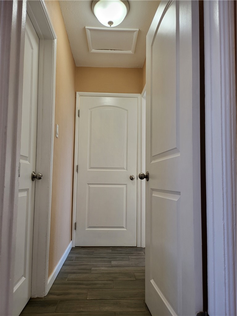 6636 Granger Avenue Bell Gardens, CA 90201 - Photo 6 of 11 a view of a hallway with wooden floor