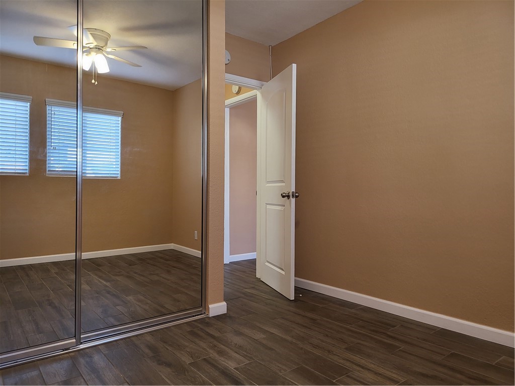 6636 Granger Avenue Bell Gardens, CA 90201 - Photo 9 of 11 an empty room with wooden floor closet and windows