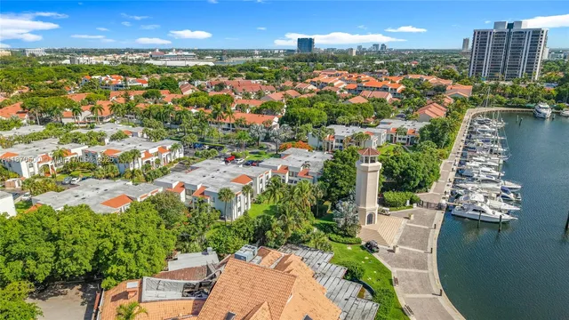 a dining room with furniture and a large window