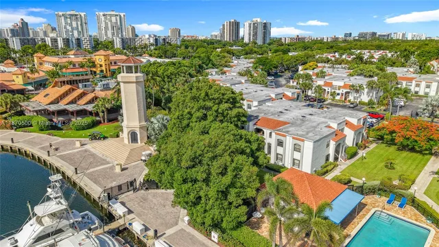 an aerial view of multiple houses with yard