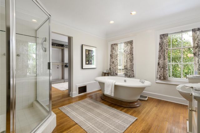 a bedroom with bed and windows