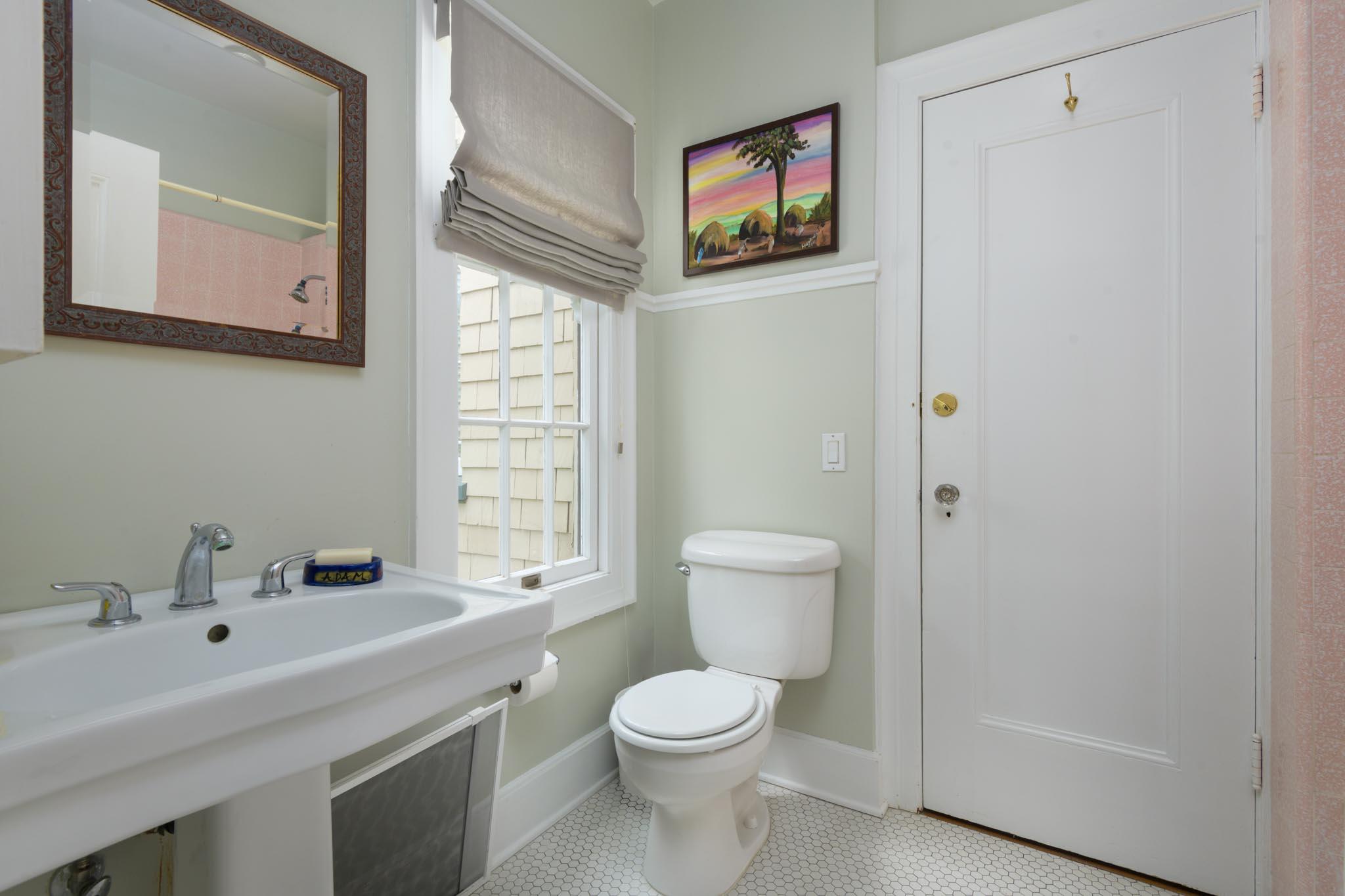 1833 Santa Barbara Street Santa Barbara, CA 93101 - Photo 17 of 35 a bathroom with a toilet sink and mirror