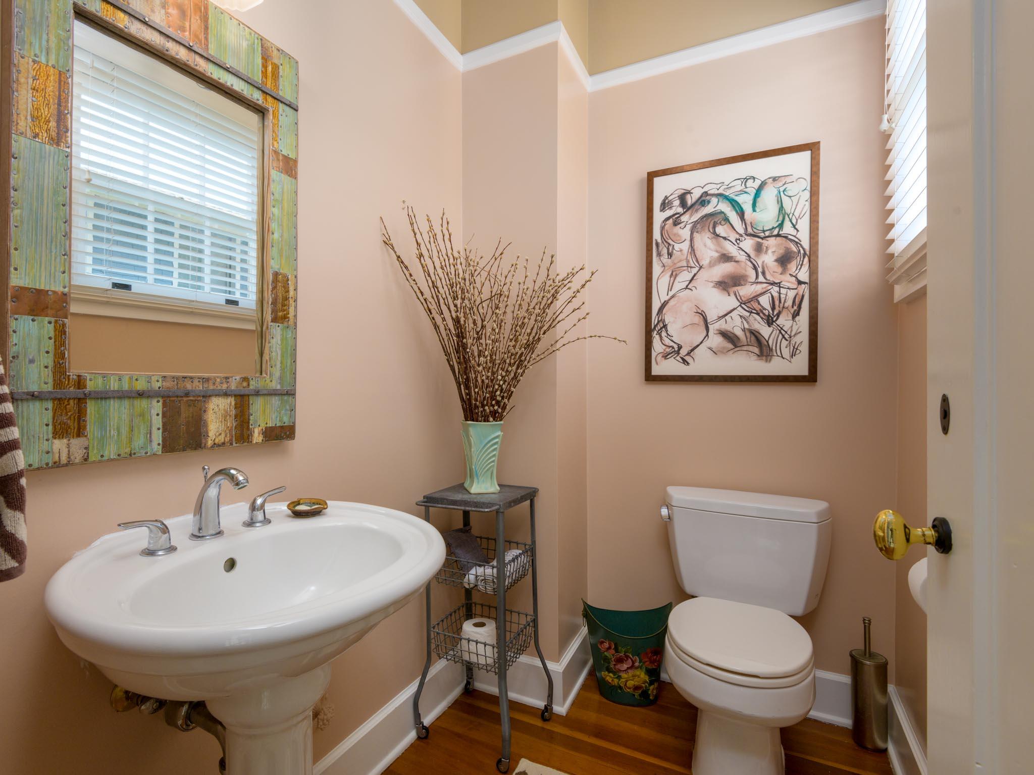 1833 Santa Barbara Street Santa Barbara, CA 93101 - Photo 22 of 35 a bathroom with a sink a toilet and a mirror