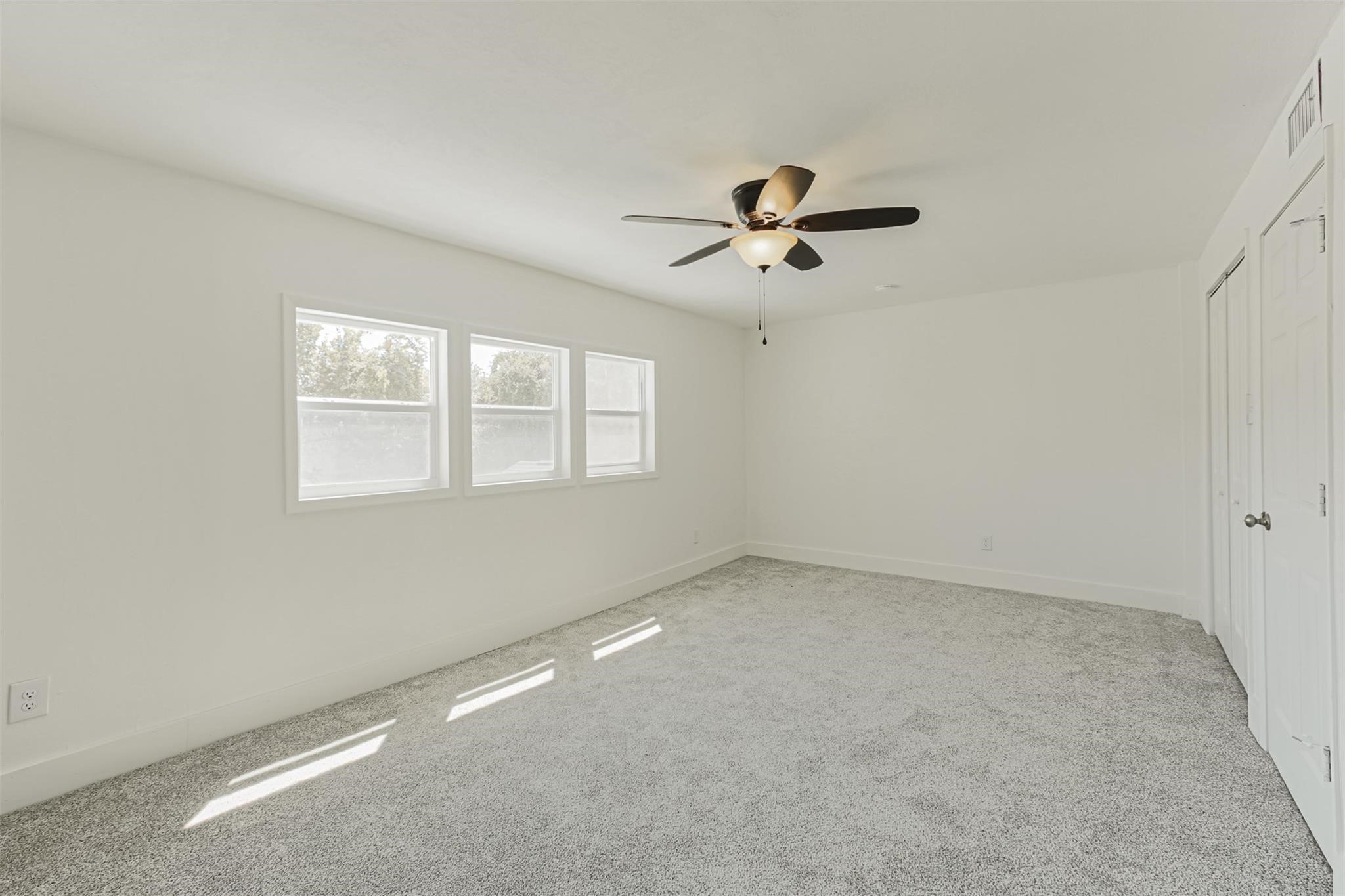 1255 Blalock Road, Unit 9 Houston, TX 77055 - Photo 11 of 15 a view of room with a ceiling fan and window