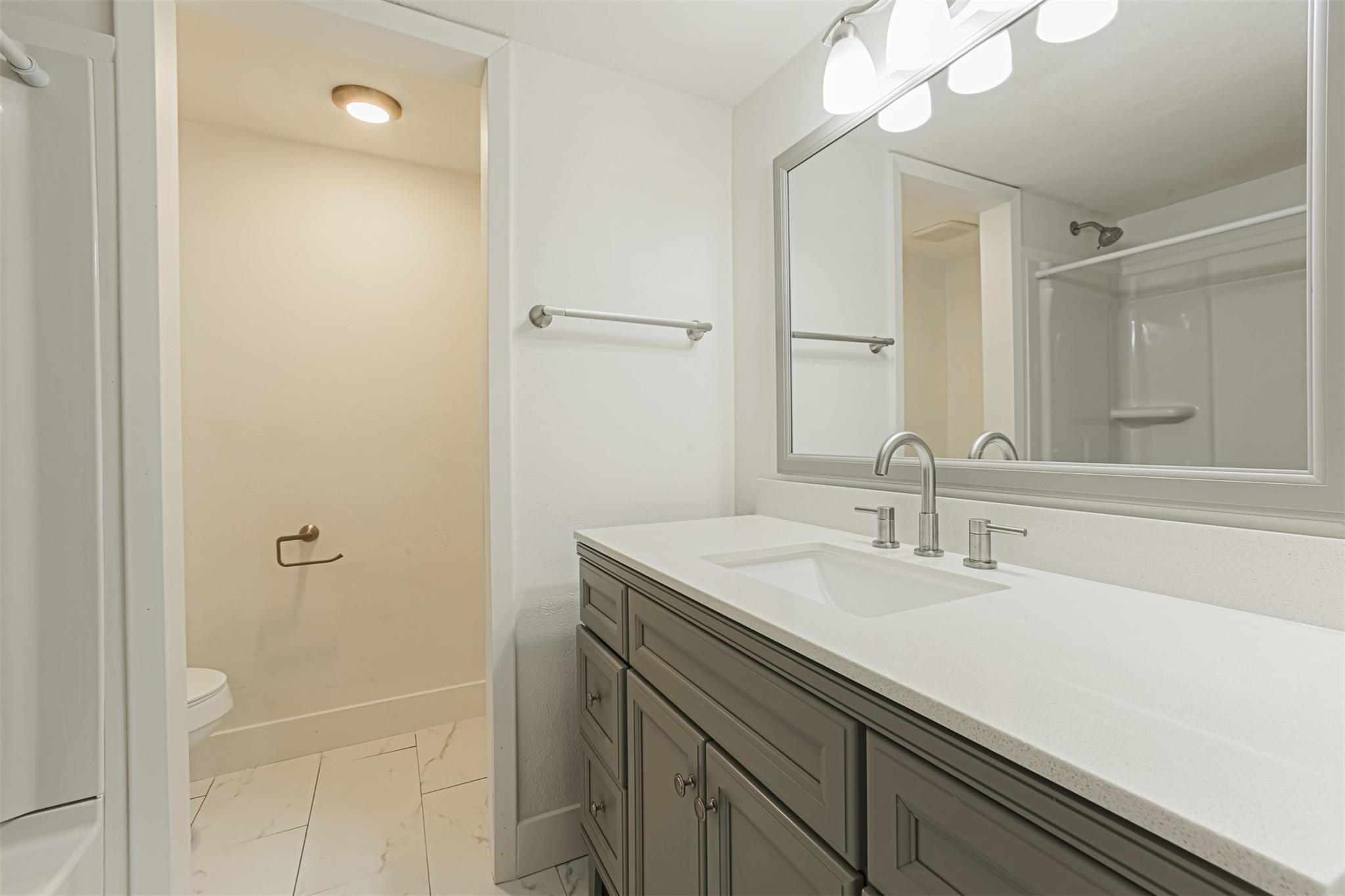 1255 Blalock Road, Unit 9 Houston, TX 77055 - Photo 12 of 15 a bathroom with a sink a vanity and a mirror