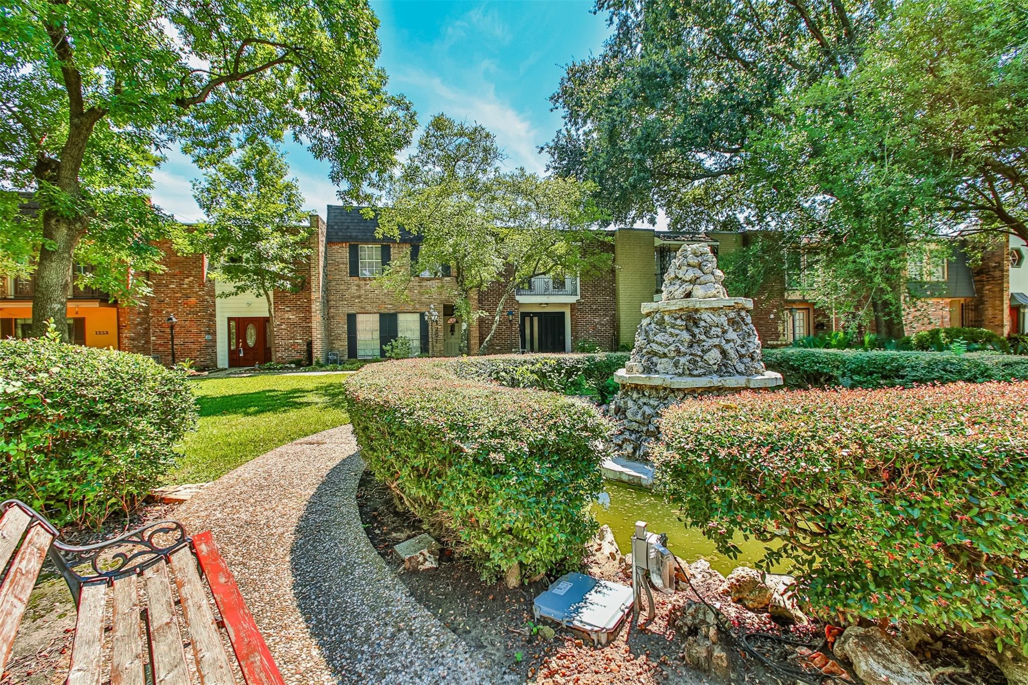 1255 Blalock Road, Unit 9 Houston, TX 77055 - Photo 4 of 15 a front view of a house with a yard