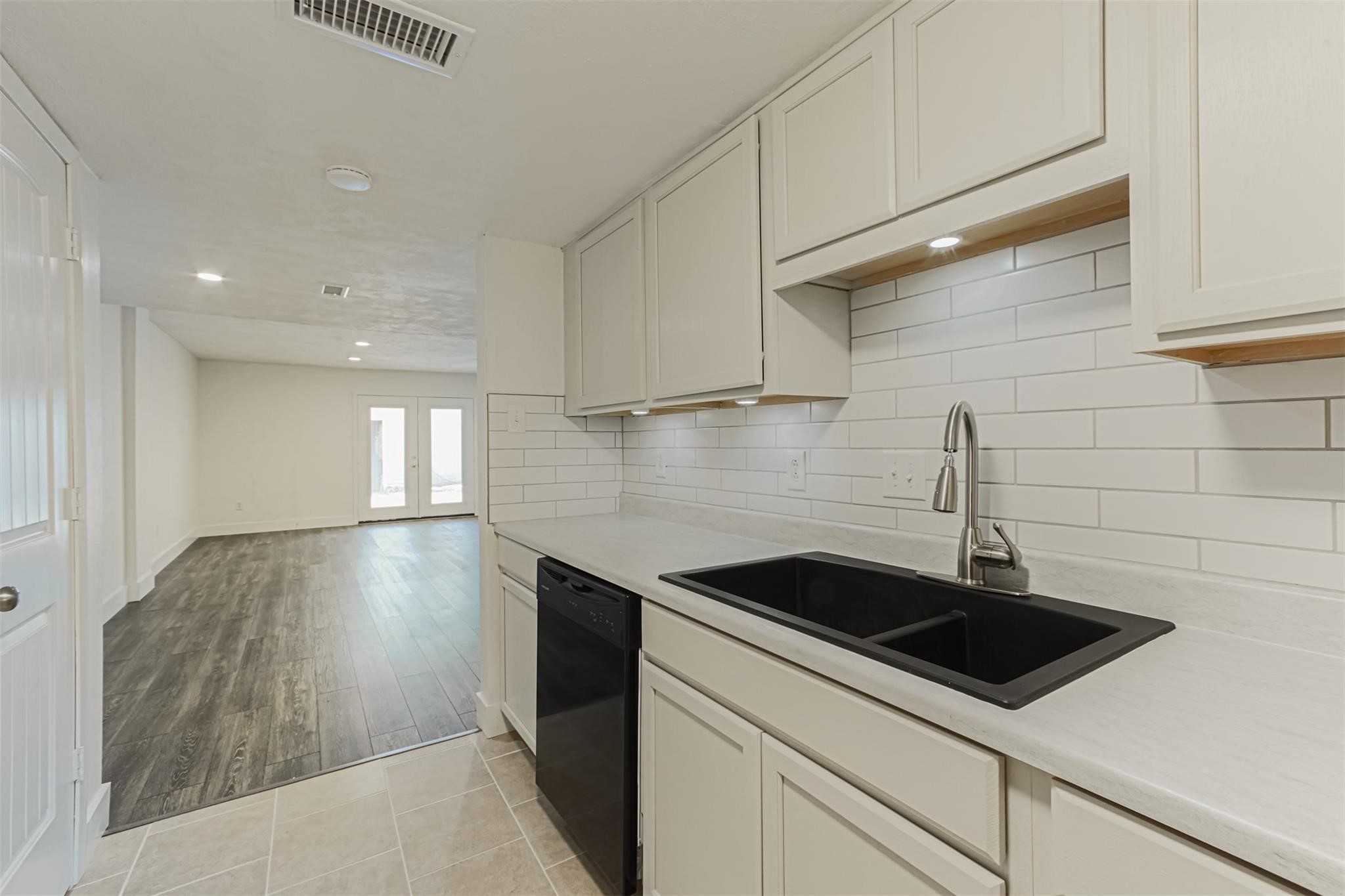 1255 Blalock Road, Unit 9 Houston, TX 77055 - Photo 7 of 15 a kitchen with a sink and cabinets