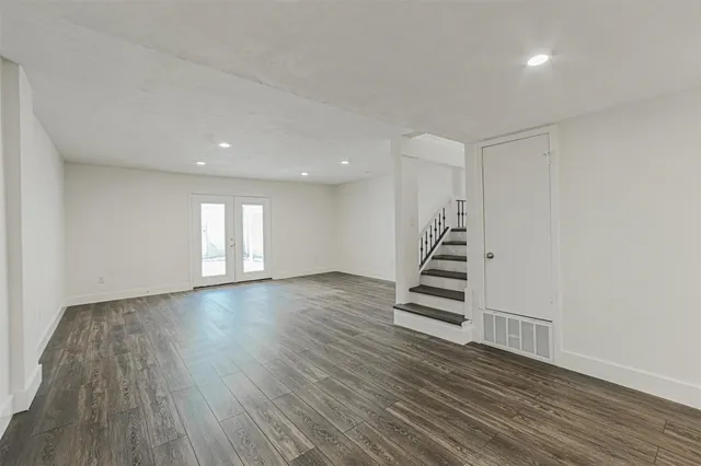 a view of an entryway with wooden floor