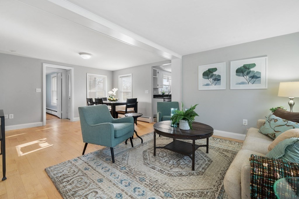 81 West Main Street Merrimac, MA 01860 - Photo 14 of 28 a living room with furniture and a potted plant