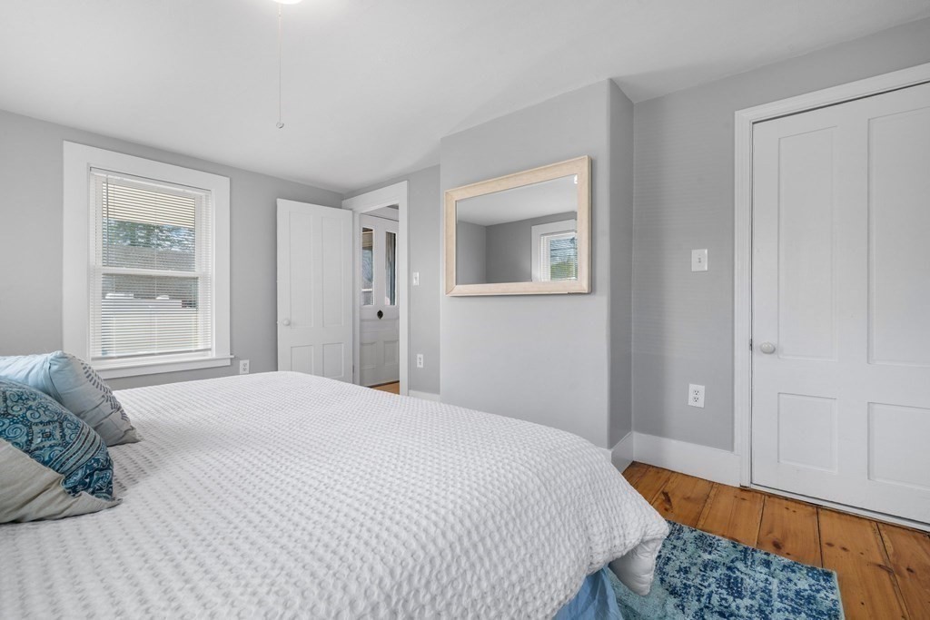 81 West Main Street Merrimac, MA 01860 - Photo 20 of 28 a bedroom with a bed and a window