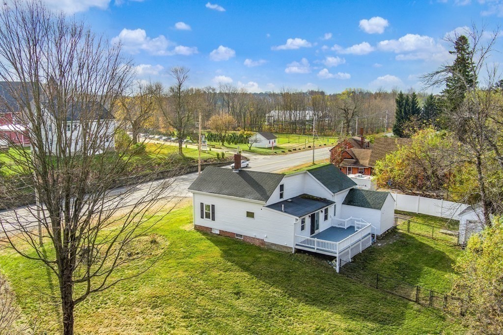 81 West Main Street Merrimac, MA 01860 - Photo 6 of 28 a view of a swimming pool with a patio and a yard