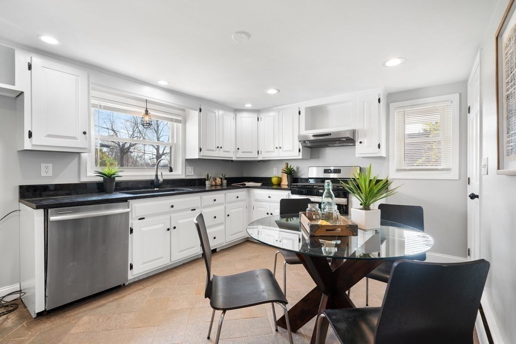 81 West Main Street Merrimac, MA 01860 - Photo 9 of 28 a kitchen with stainless steel appliances granite countertop a stove top oven a sink a refrigerator and white cabinets