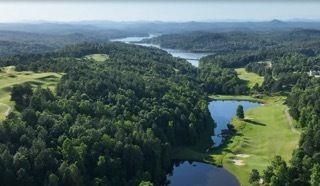 a view of a lake with a yard