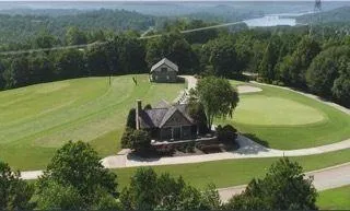 an aerial view of a house with yard swimming pool and outdoor seating