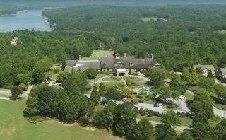 a view of a field with trees in the background