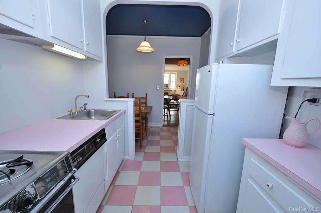949 Palmer Road, Unit 6H Bronxville, NY 10708 - Photo 13 of 48 a kitchen with a sink stainless steel appliances and cabinets