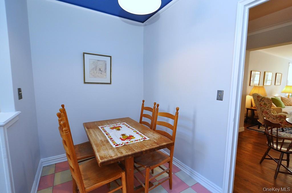 949 Palmer Road, Unit 6H Bronxville, NY 10708 - Photo 15 of 48 a view of a dining room with furniture and a wooden floor